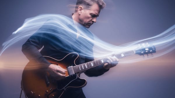 Artistic motion blur of adult musician transitioning into a grounded playing posture, representing freedom through mobility”