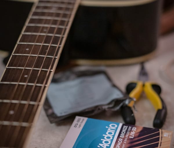 Guitar being prepared to be setup with lighter strings to support easier playing 
